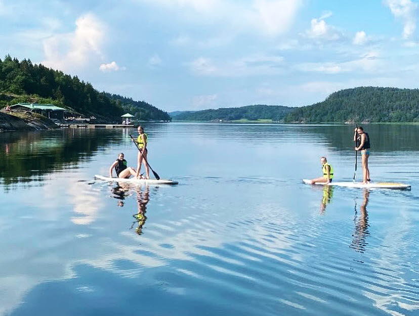 Hotel guests paddle on SUP boards on the Gullmarsfjorden