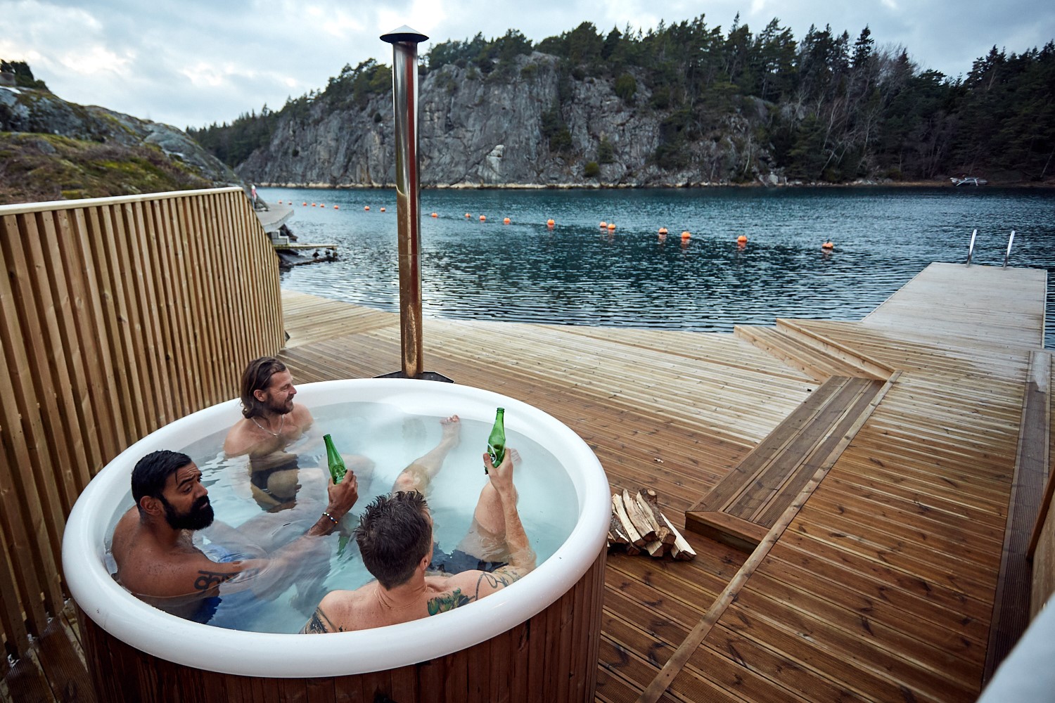 Three men in a tub at Lagunen Camping.