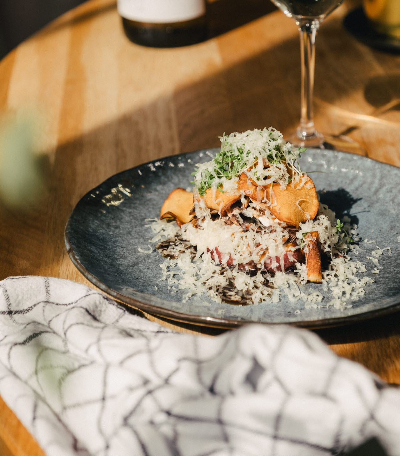 A delicious dish and some wine served in the restaurant at Hotel Strana
