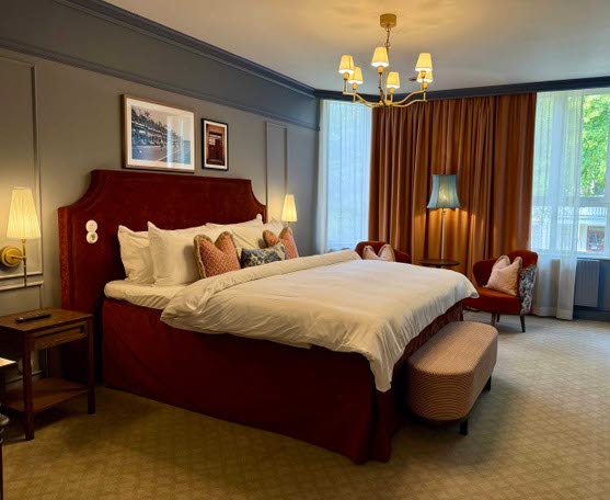 A beautifull hotel suite with a double bed at Karstorp Säteri