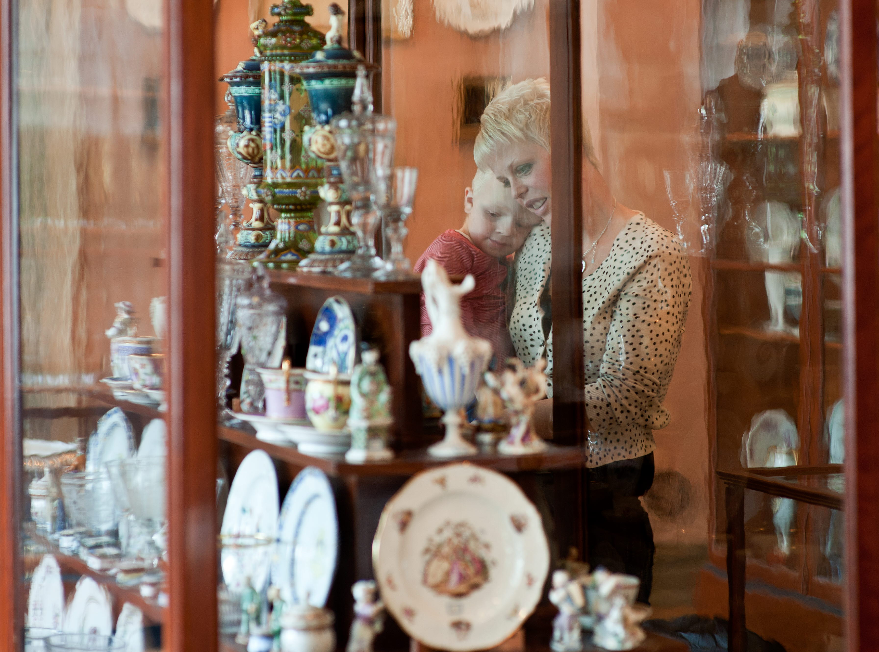 Woman with child in a museum.