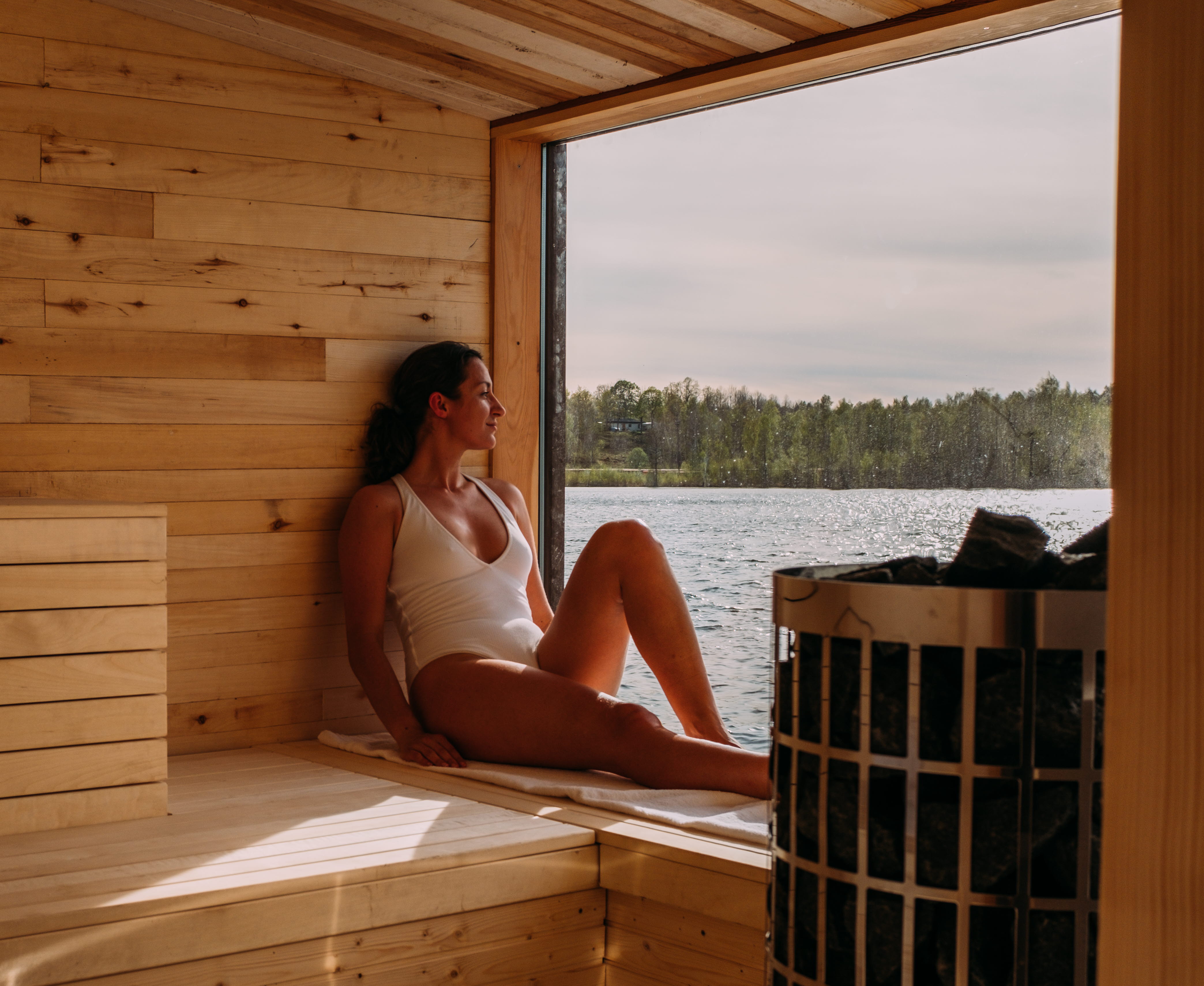 Woman sitting in a sauna