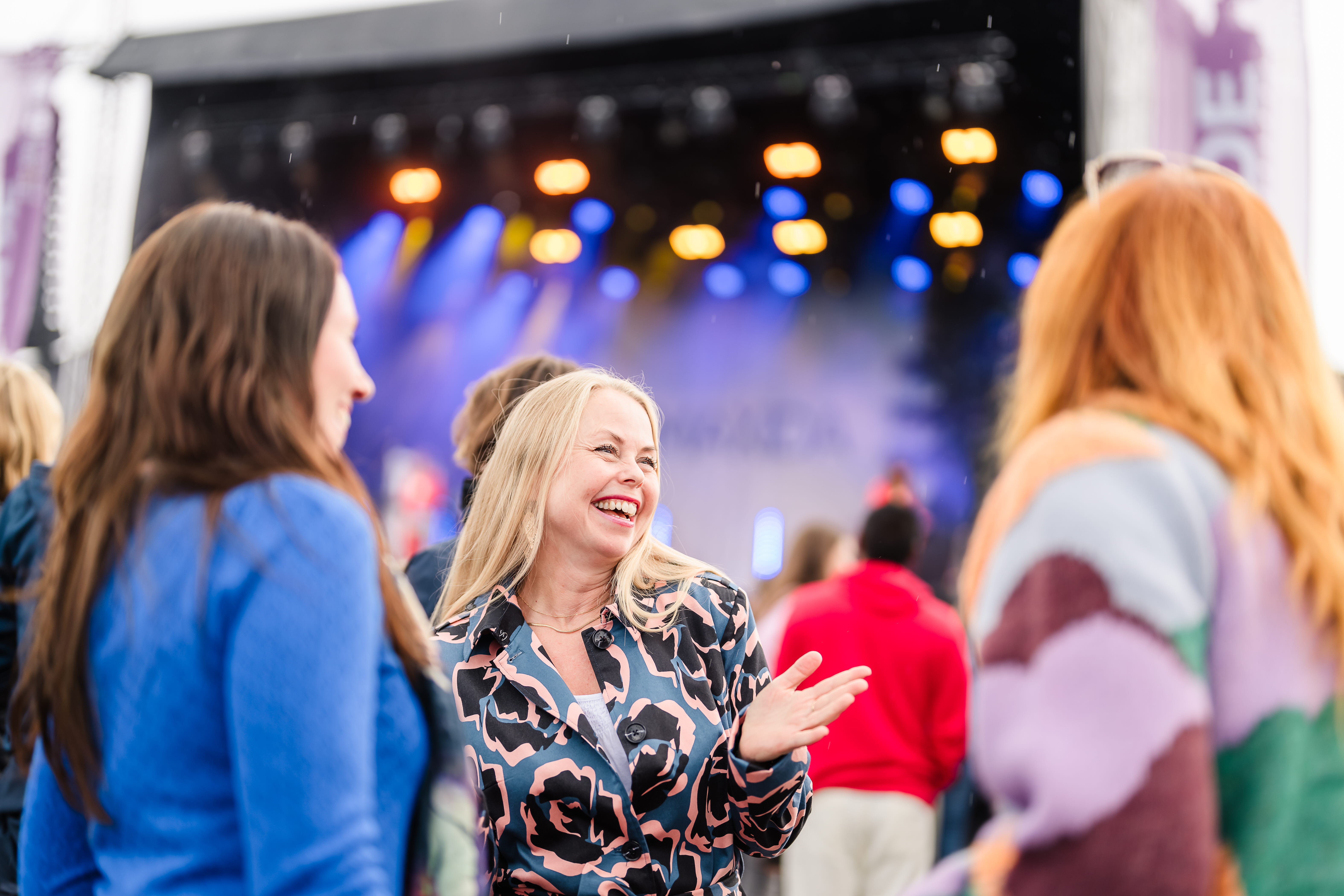 Friends having fun at a music festival.