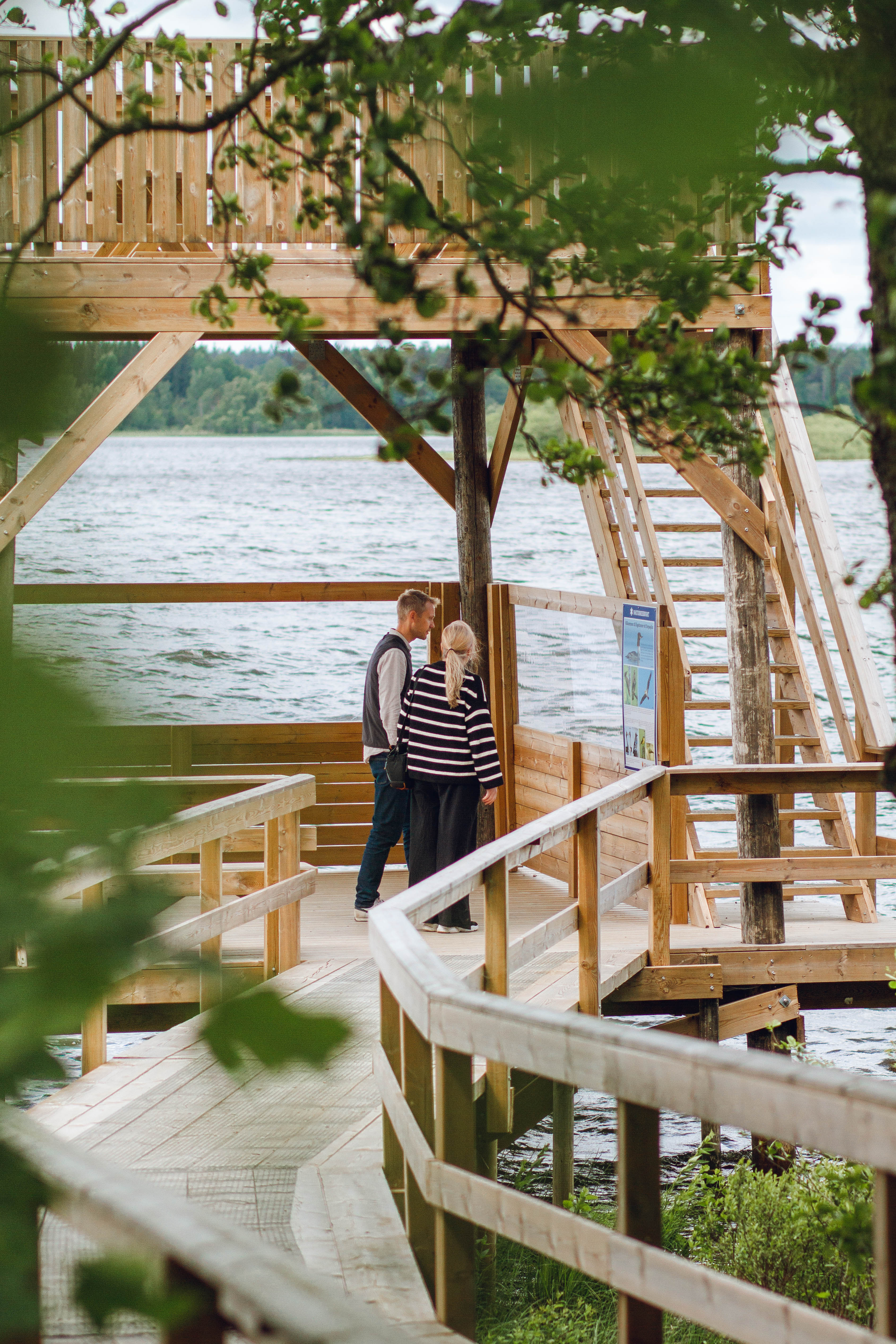 People walking by a lake.