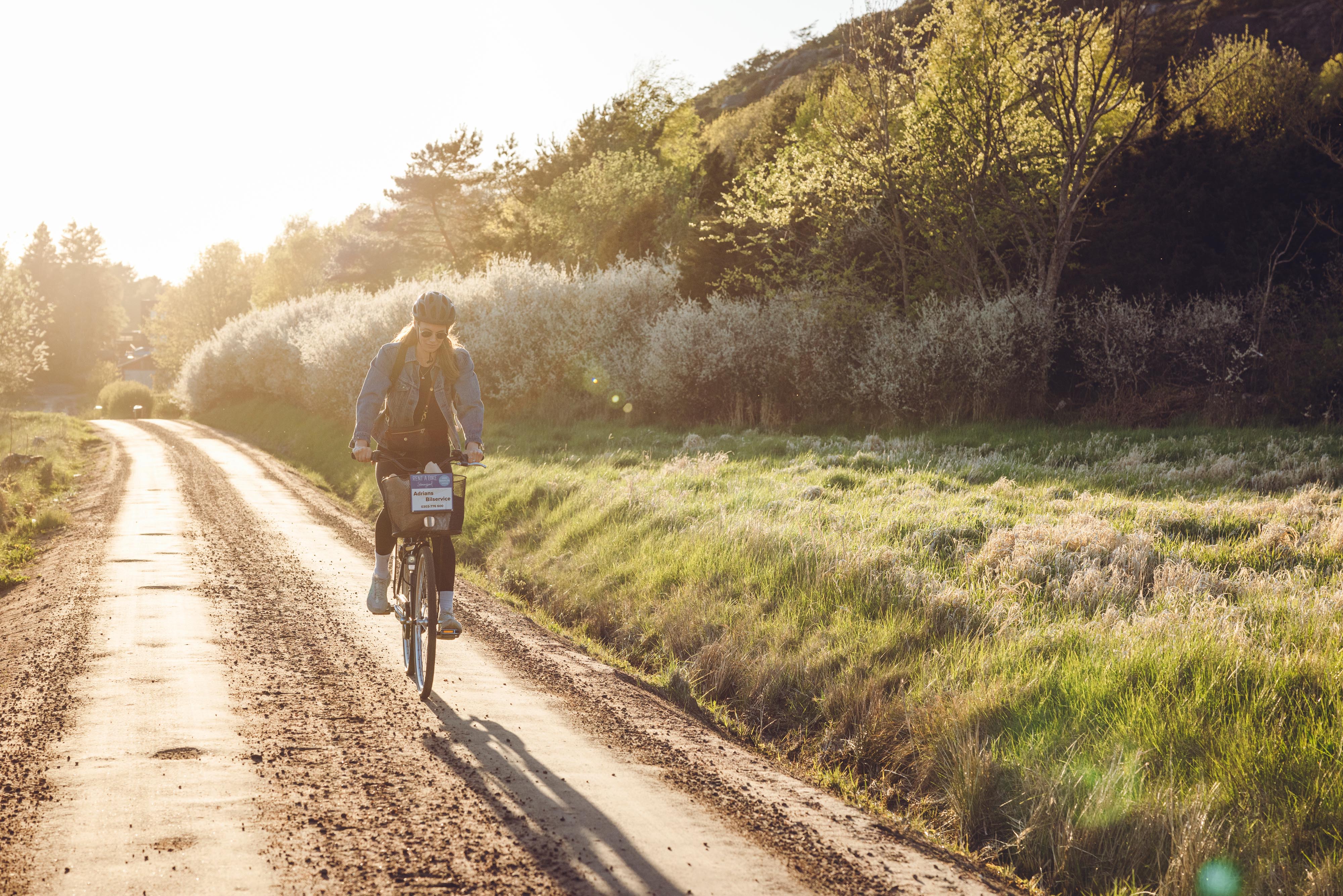 Woman on cycling holiday in West Sweden.