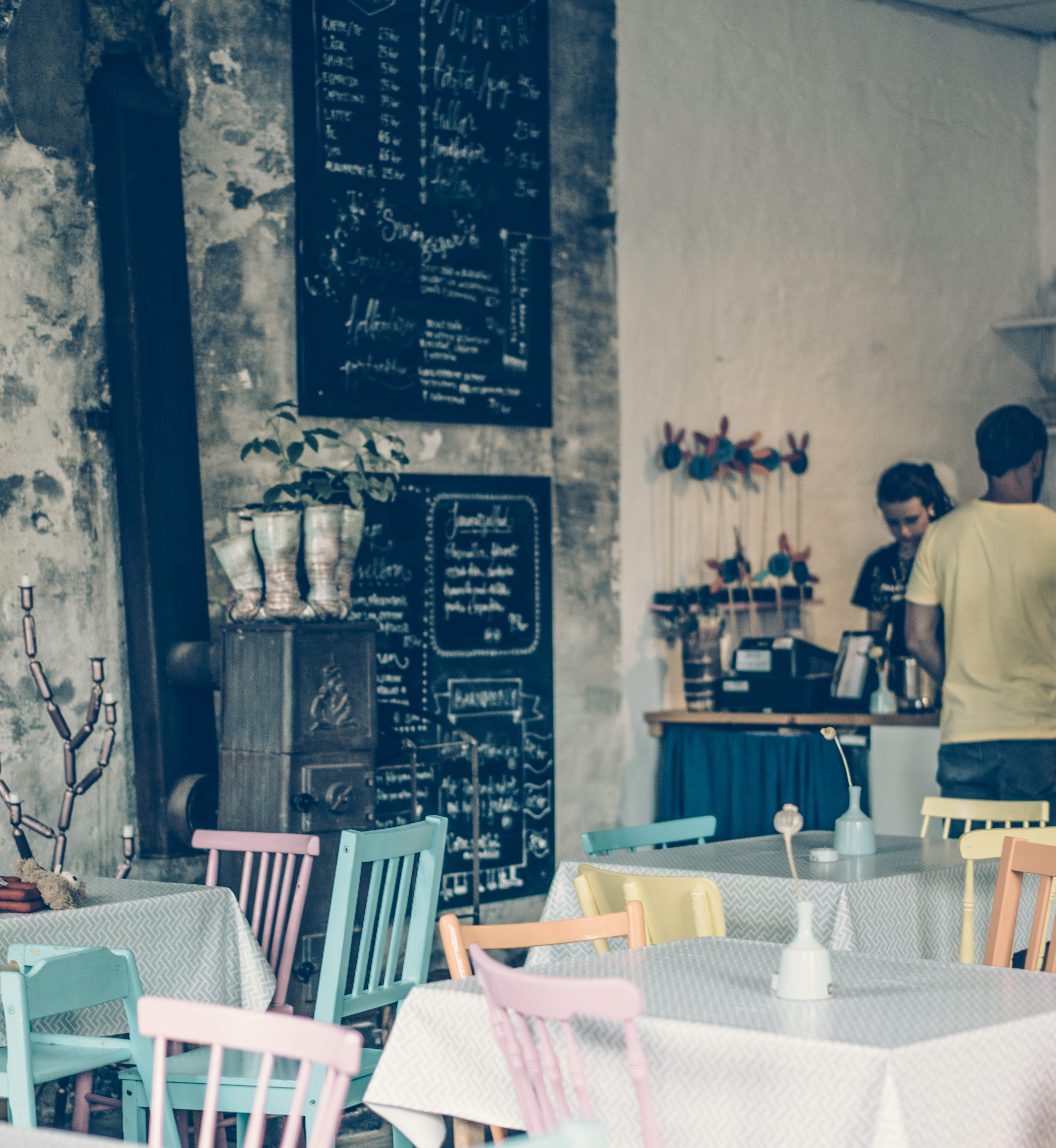 Colorful chairs and tables inside the cafe Not Quite