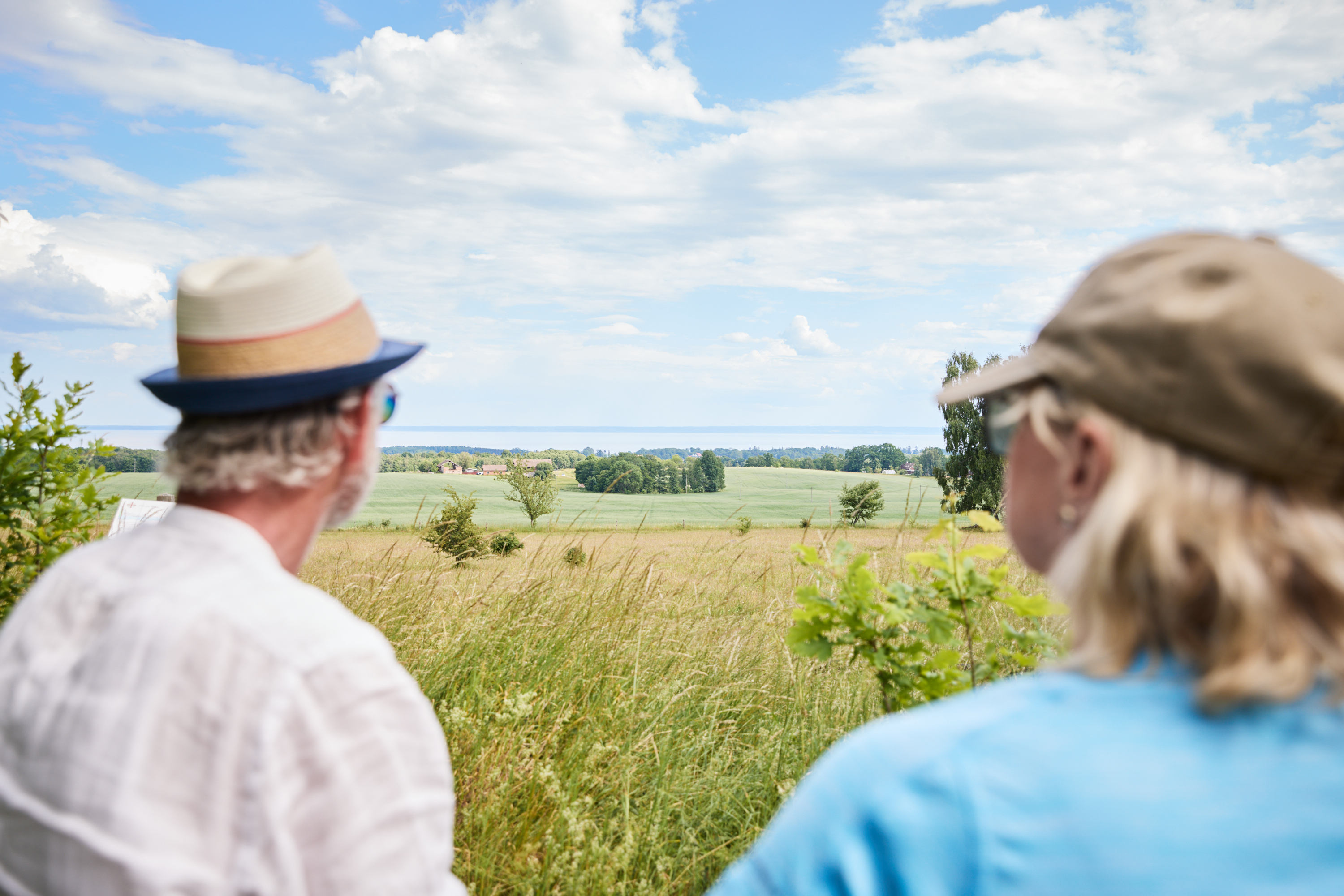 Two people are sitting on a bench and resting.