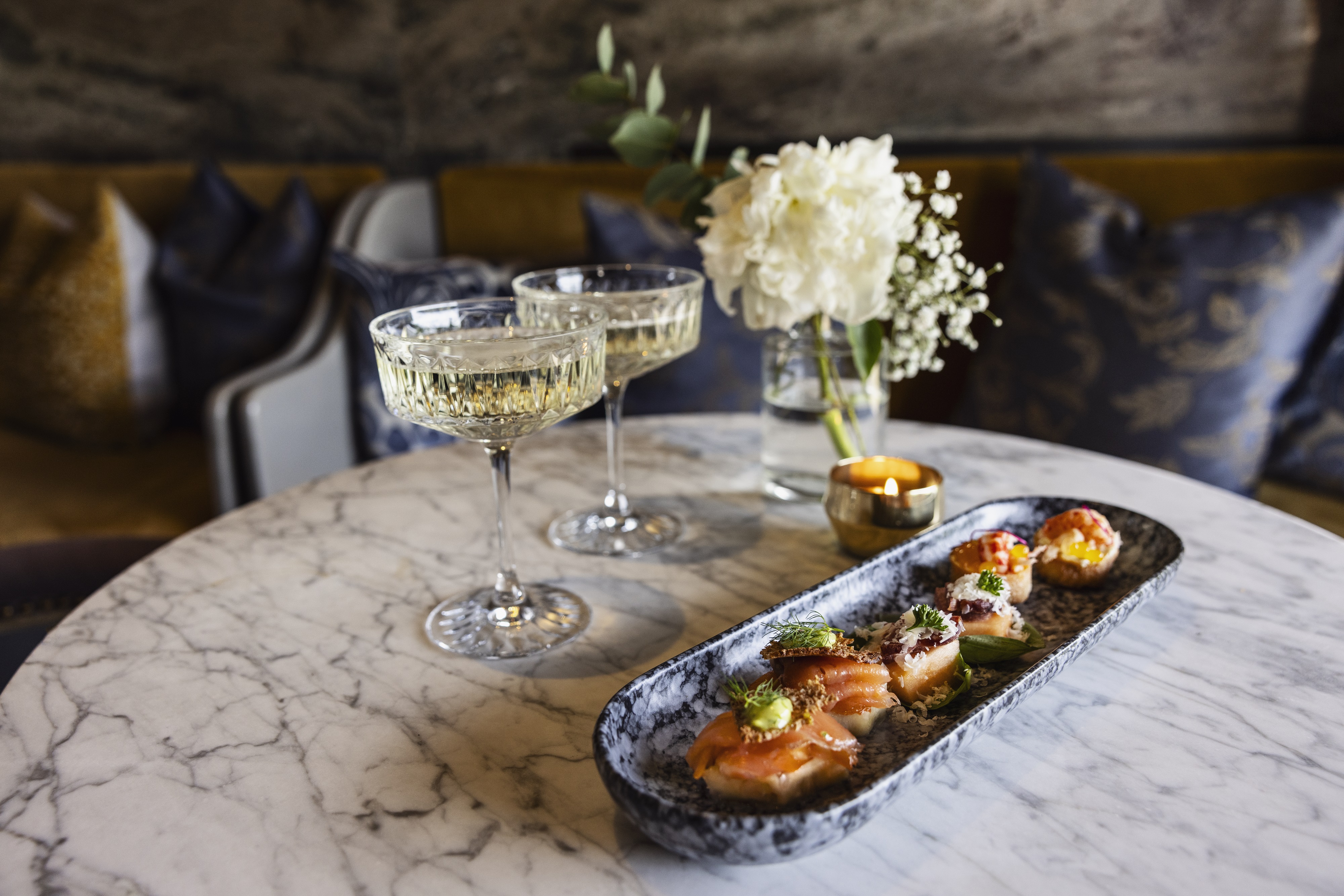 Two hands making a toast.