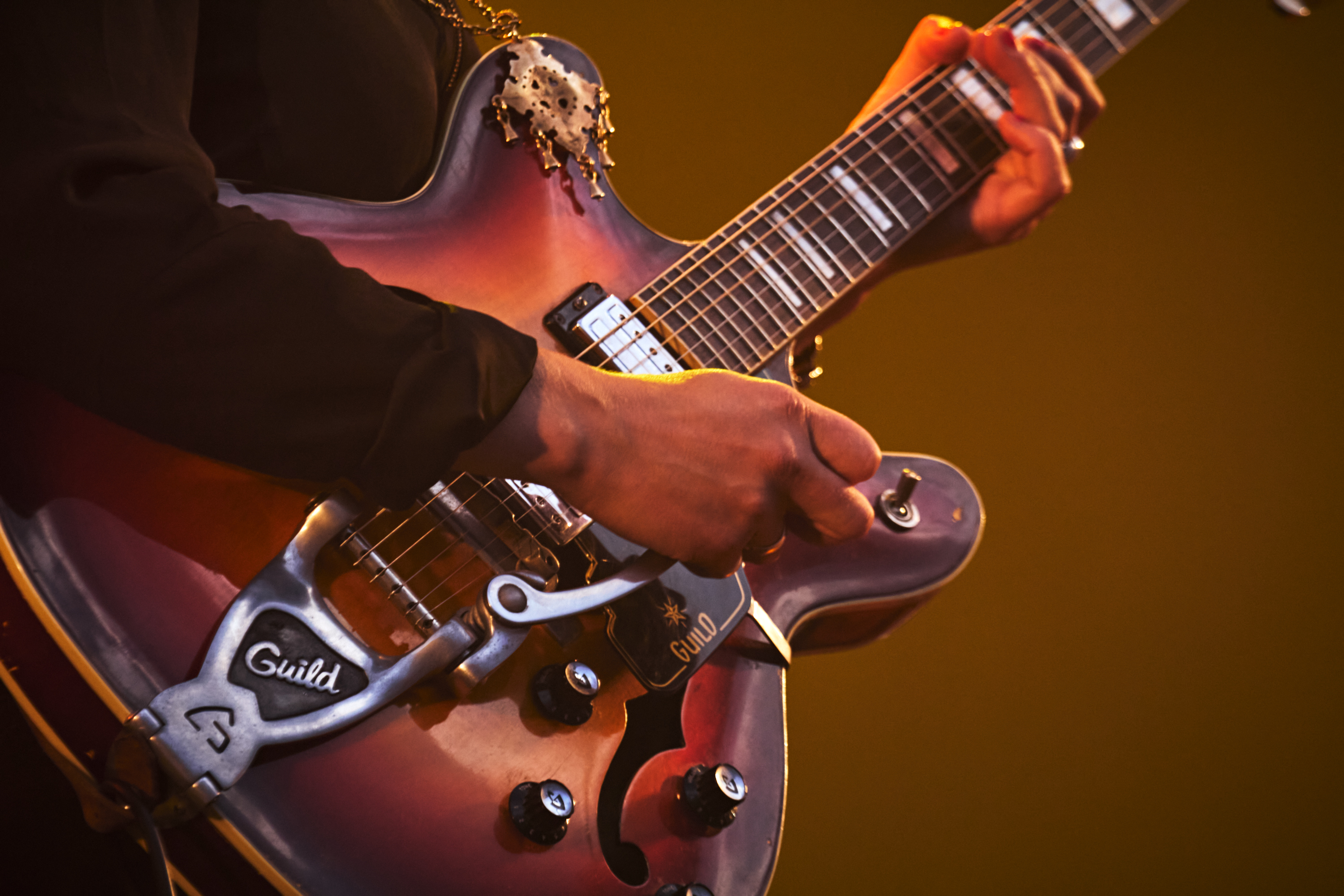 Musician playing instrument.