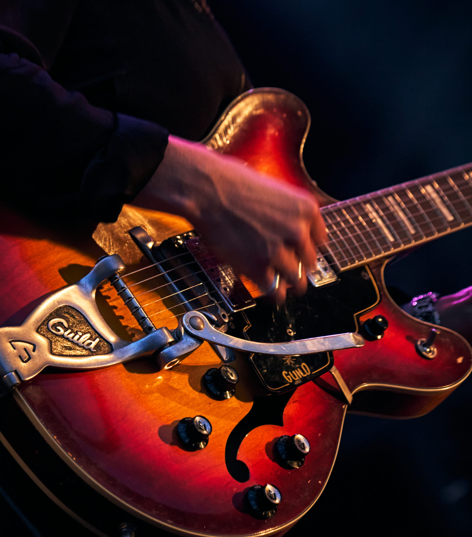 Musician playing instrument.