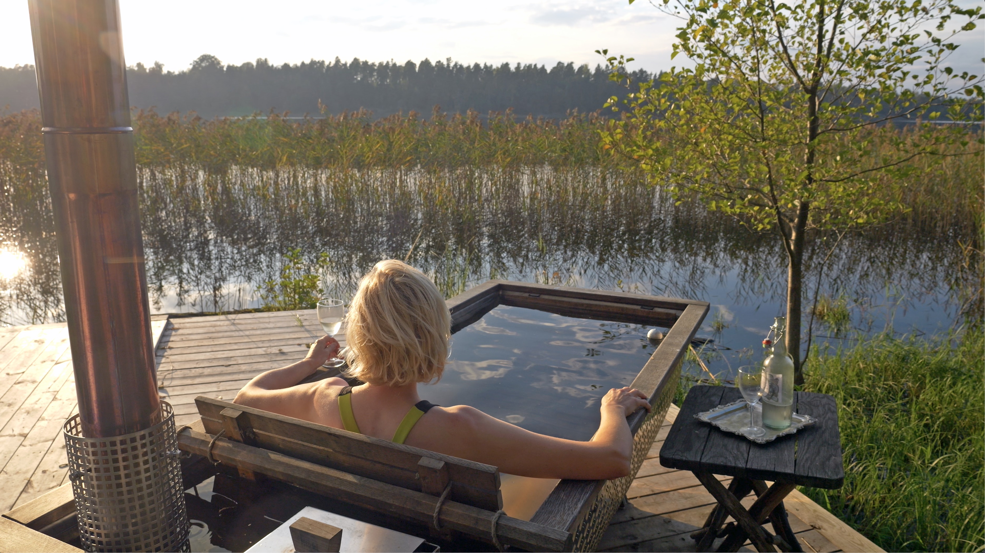 Woman sitting in a bathtub.