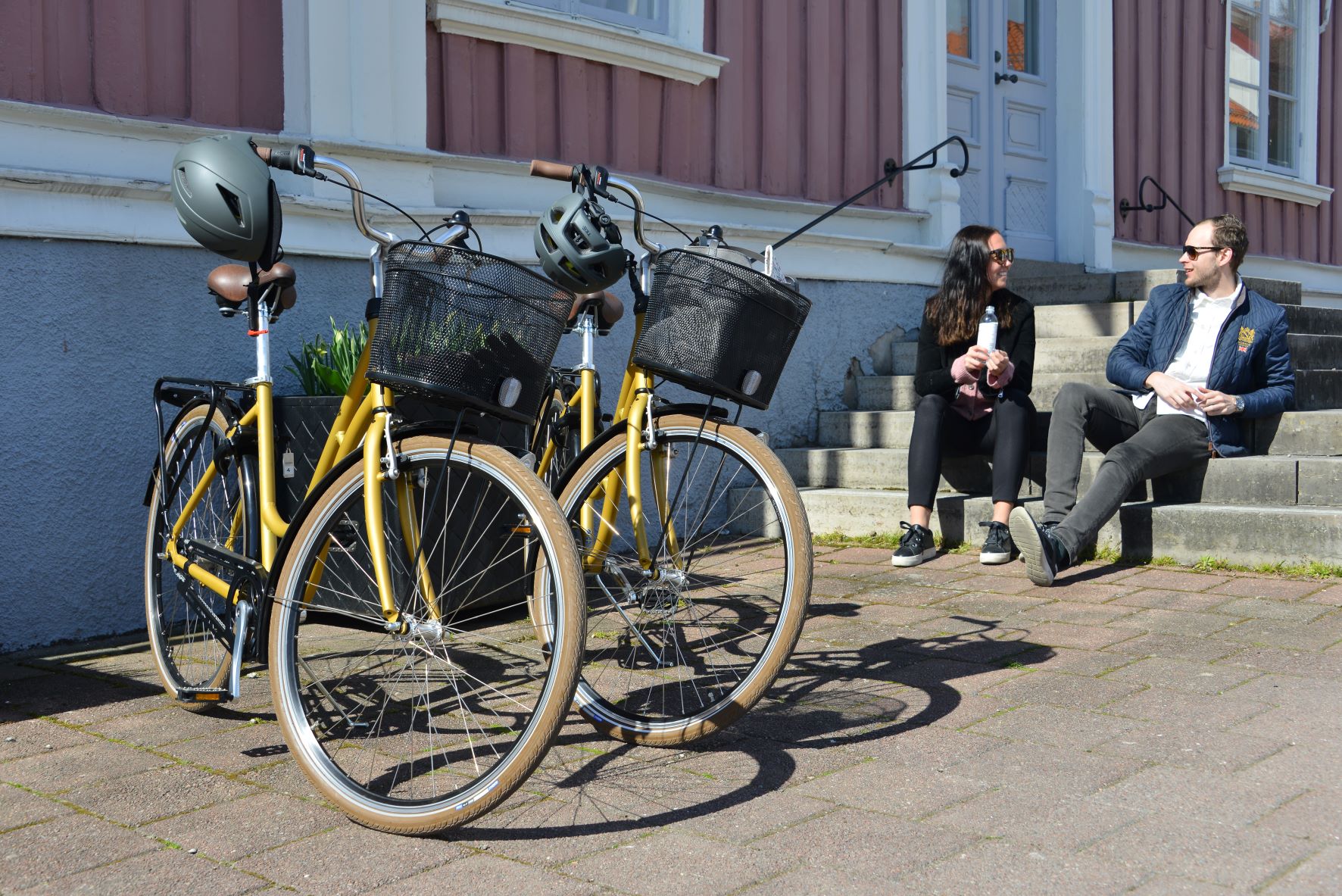 Two persons with their rented bicycles
