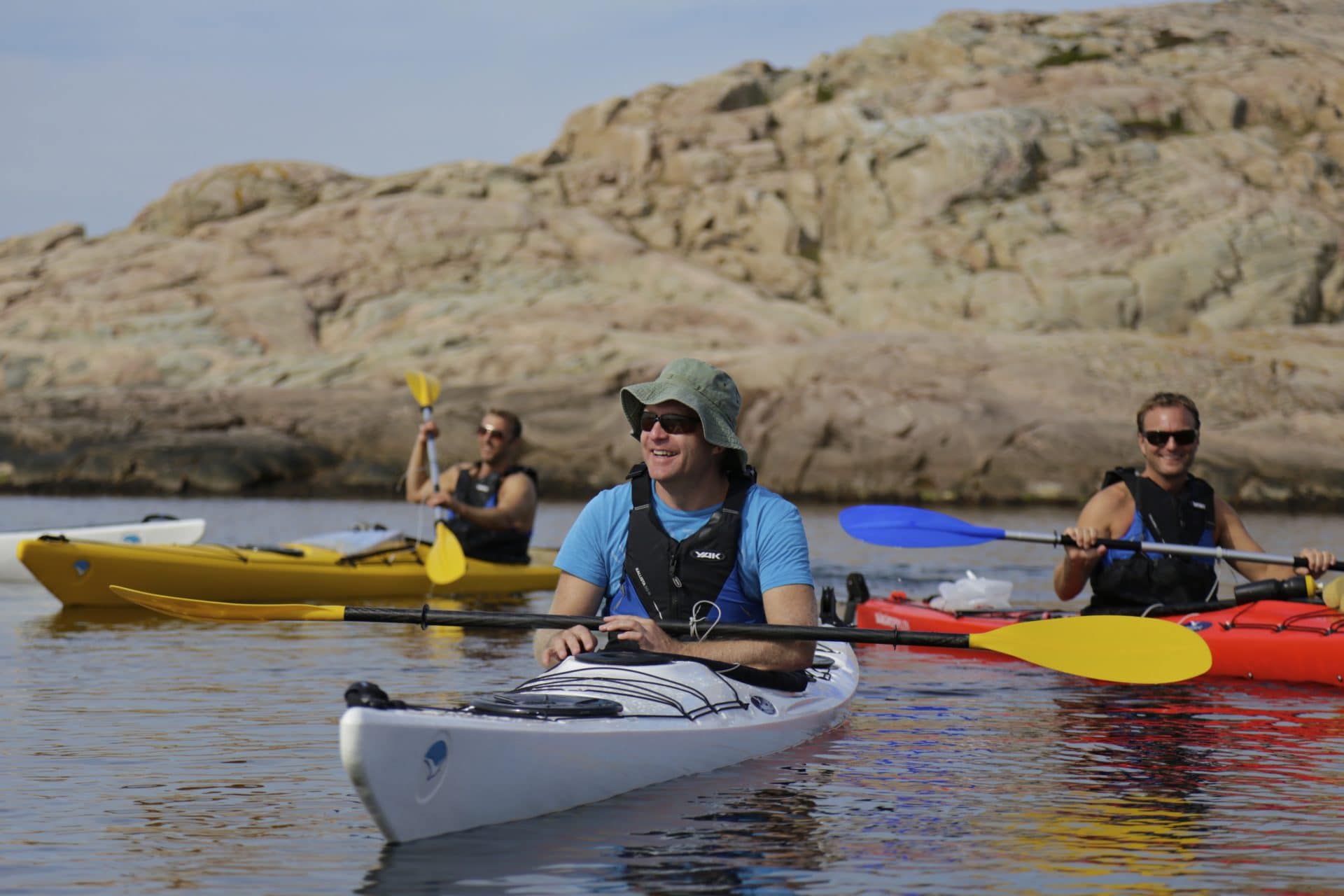 People paddling kayak.