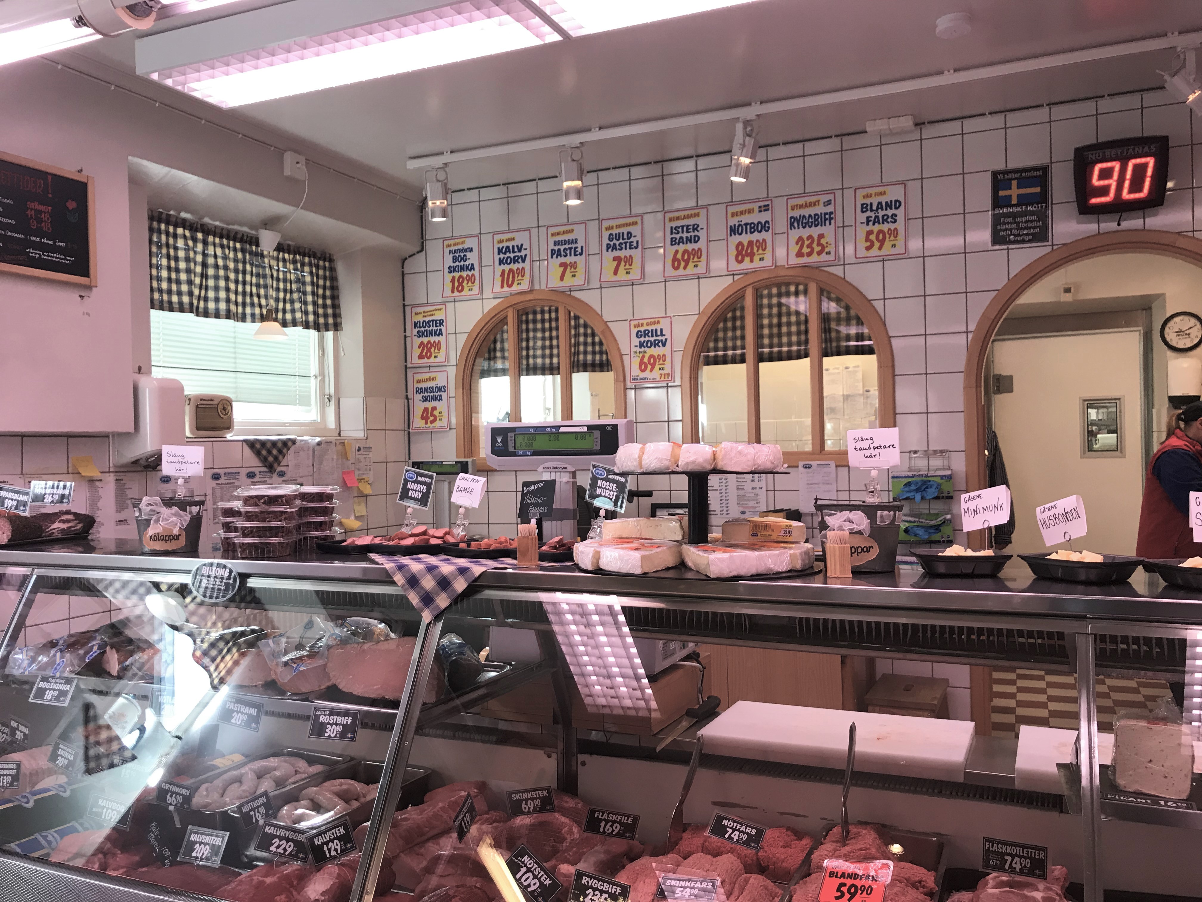 A desk with sausages in a deli store
