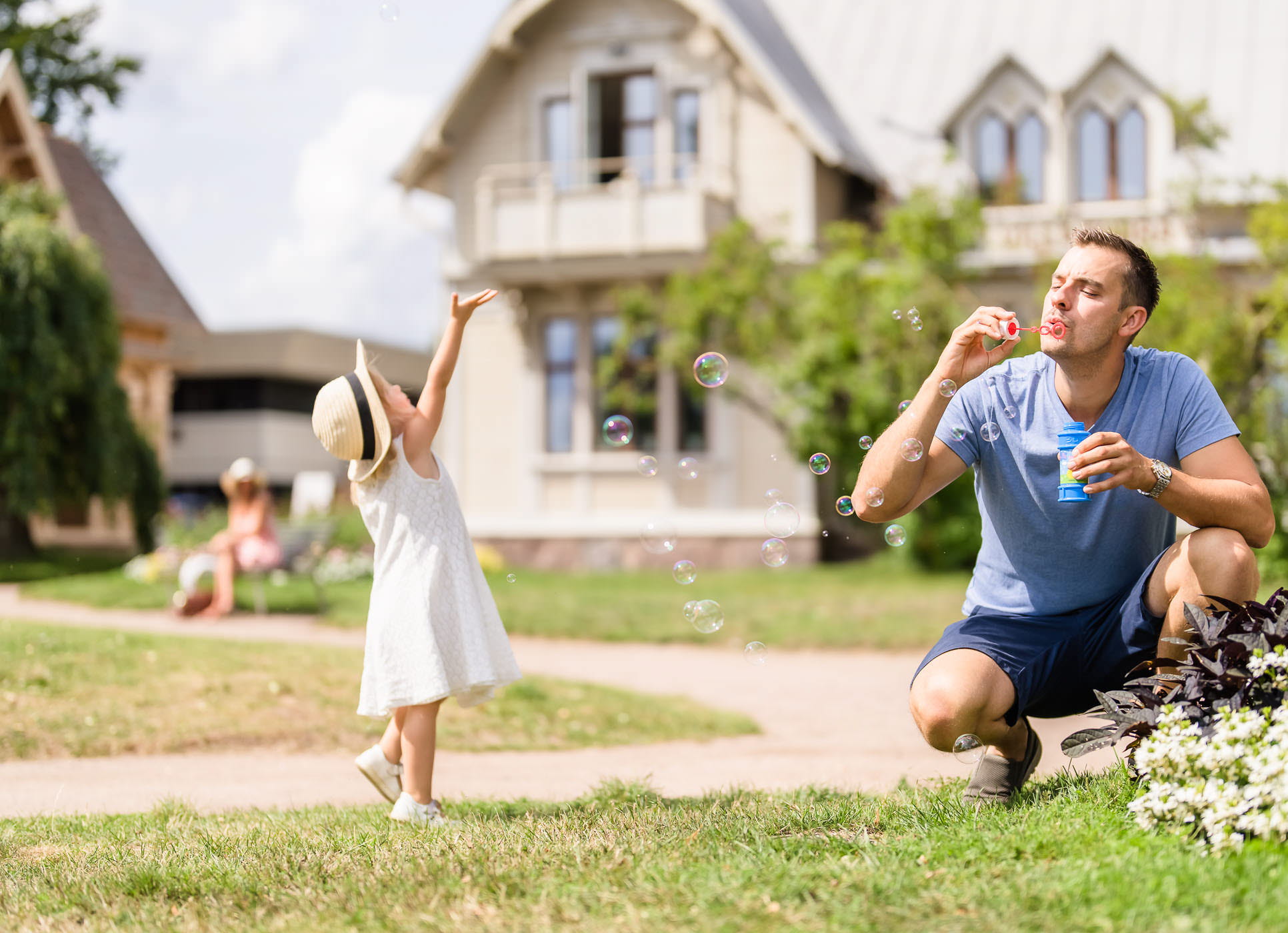 Father and daughter playing in the town park of Hjo. 