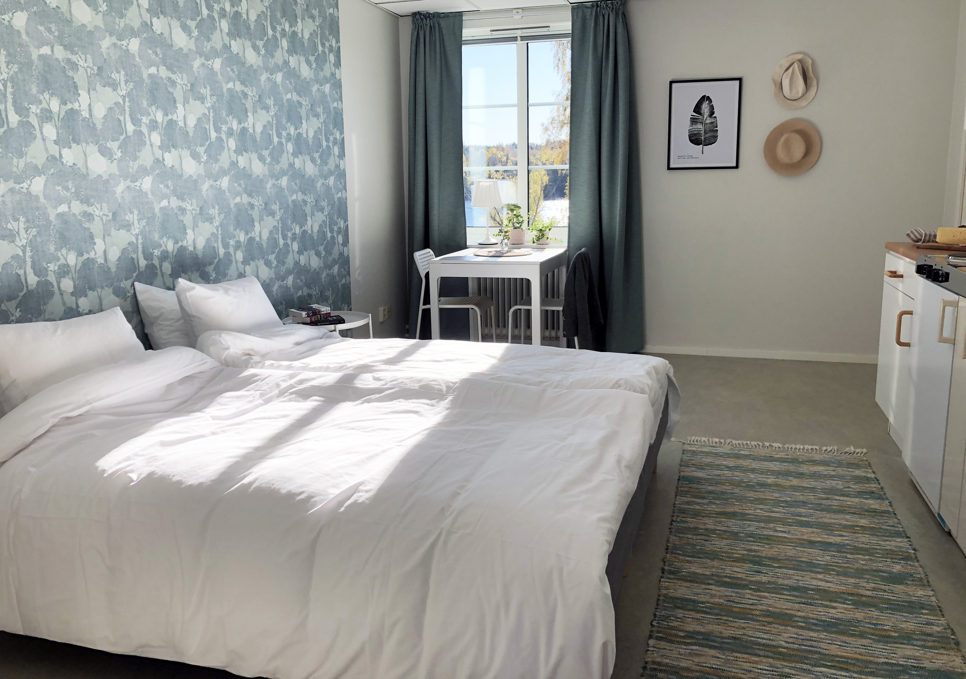 Steam boat engineer standing on board steamboat Trafik looking out over Hjo harbour 