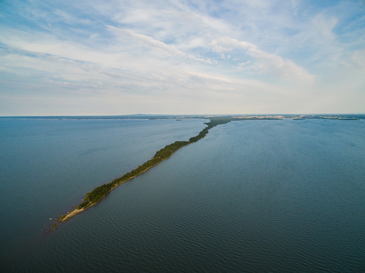 Aerial view over a 5km strip of land leading straight out in the lake of Vänern.