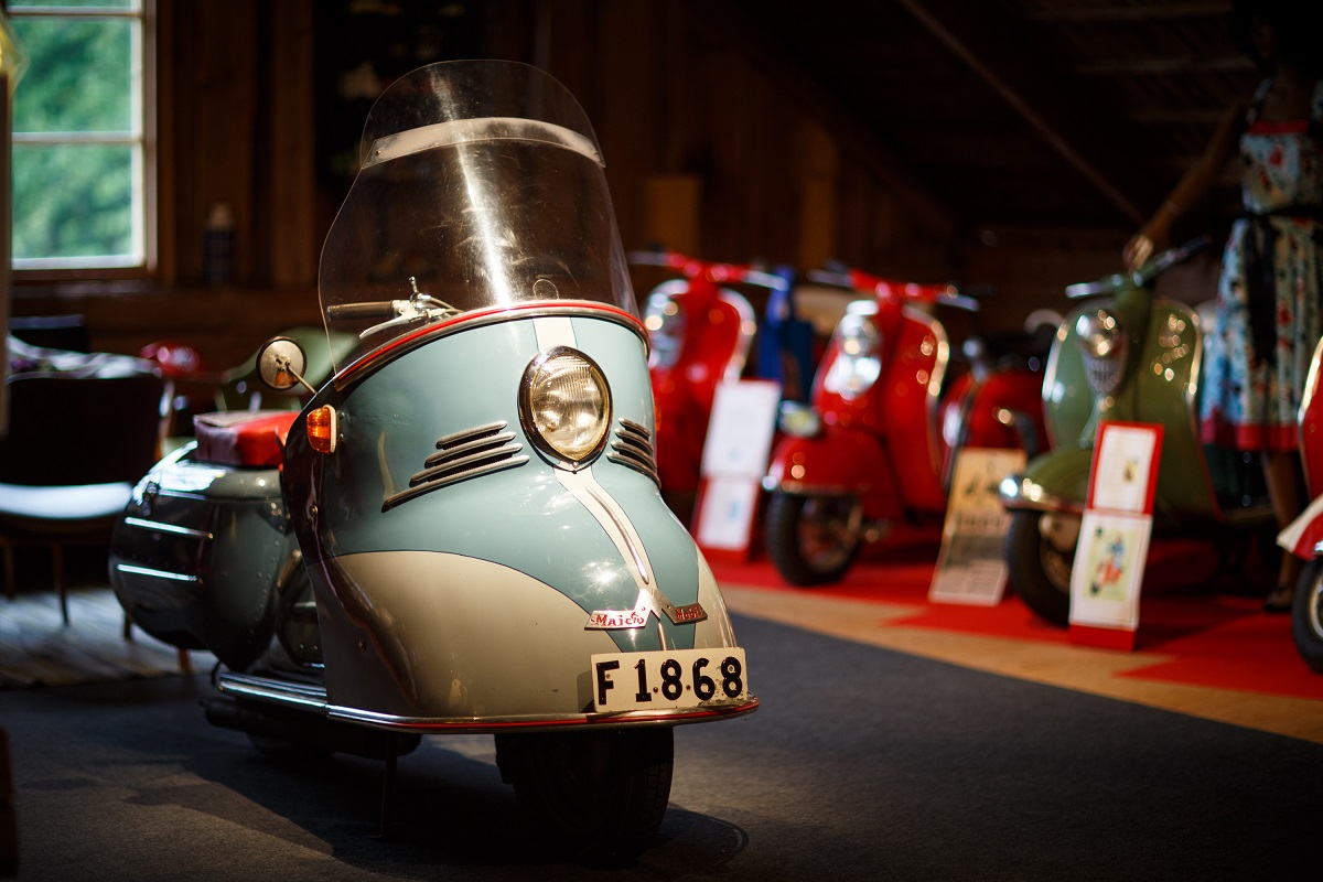 A vespa moped in a museum