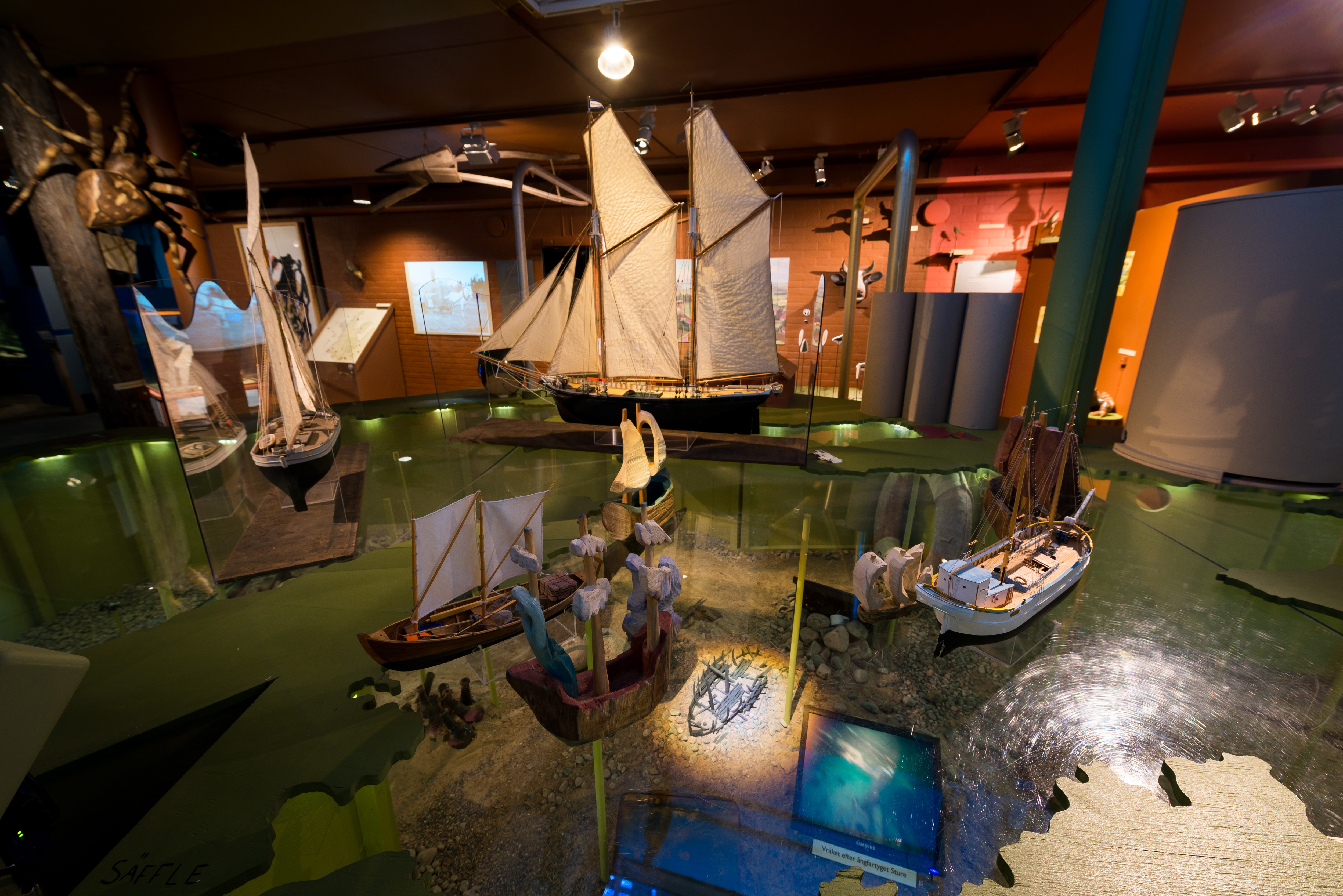 An exhibition with small ships at a museum

