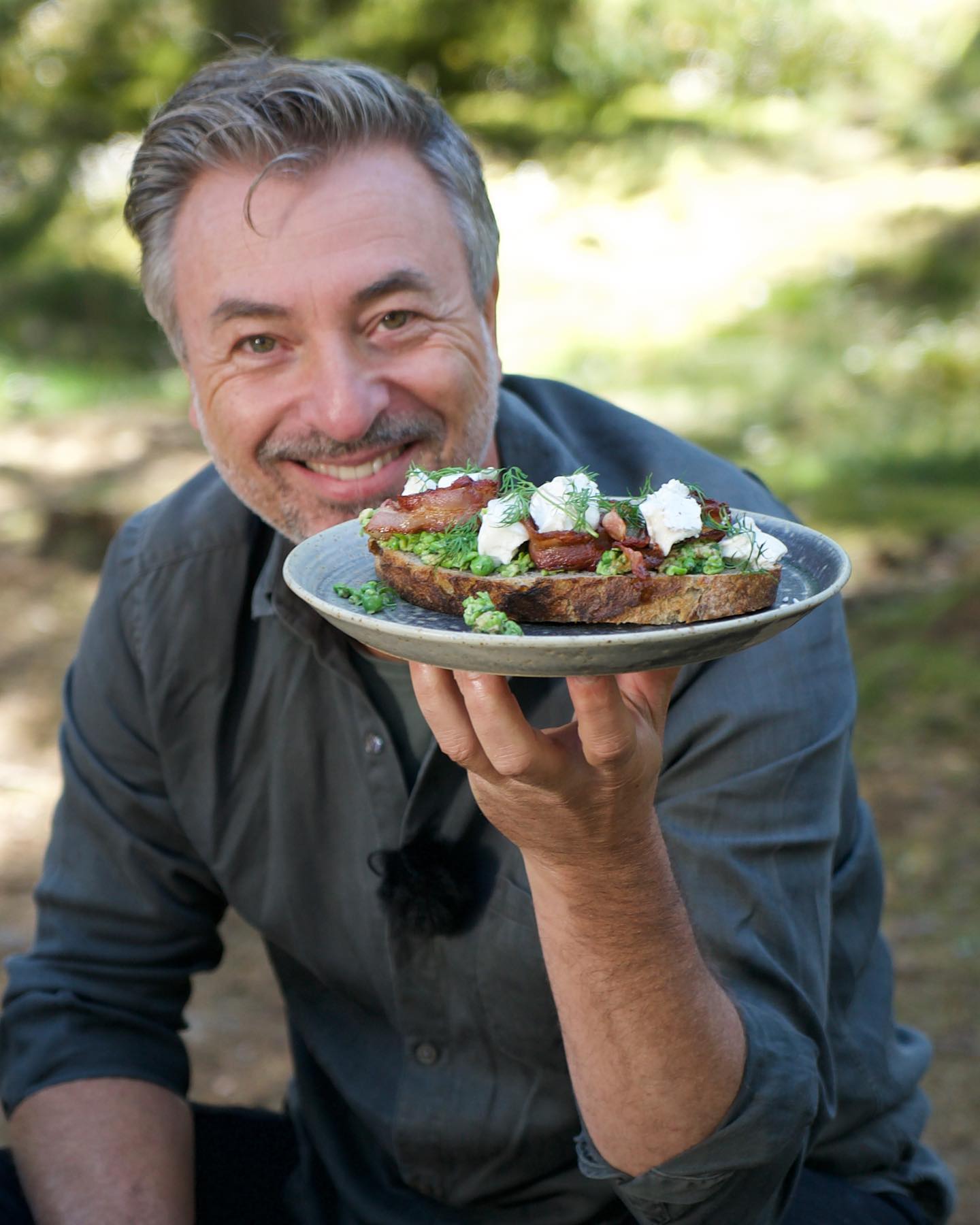 Chef Tareq Taylor with sandwich at Erikson Cottage,