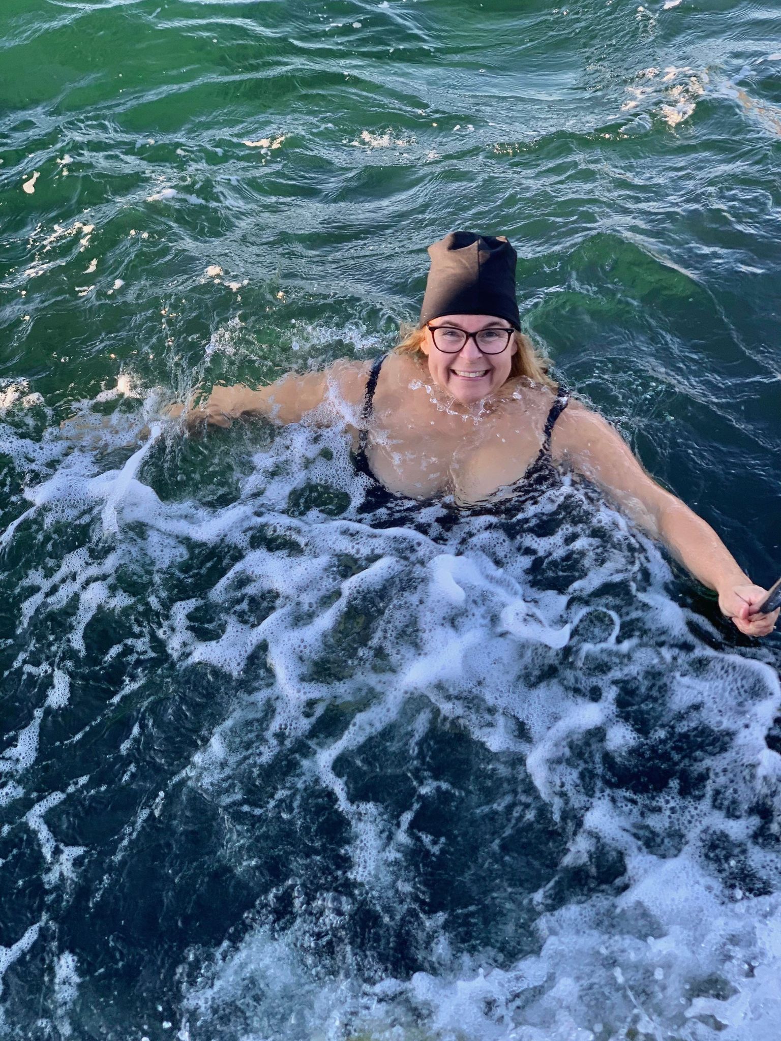 Woman taking a winter bath at Rödbergsvik Östersidan Skaftö Lysekil