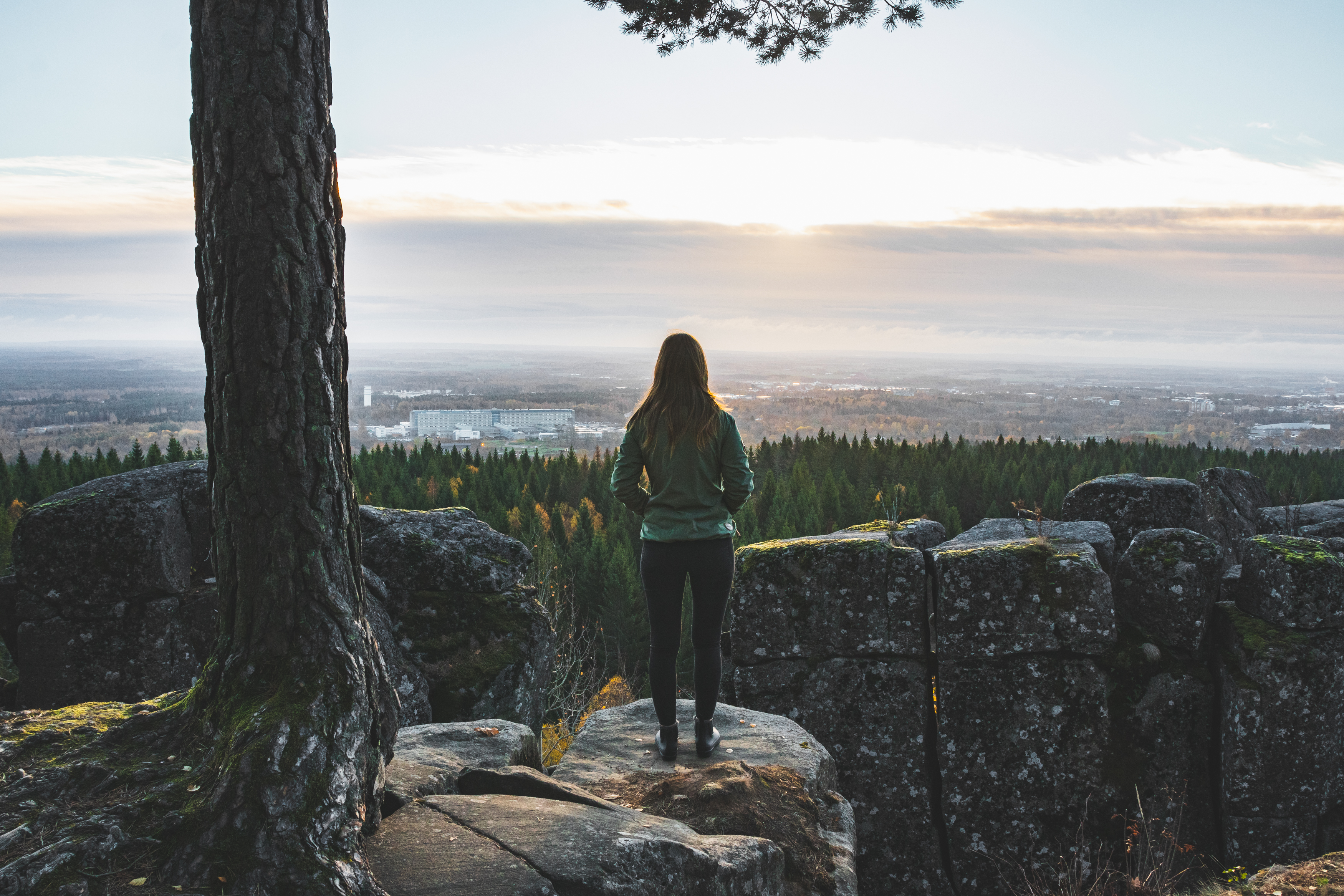 A person looking out from a mountain
