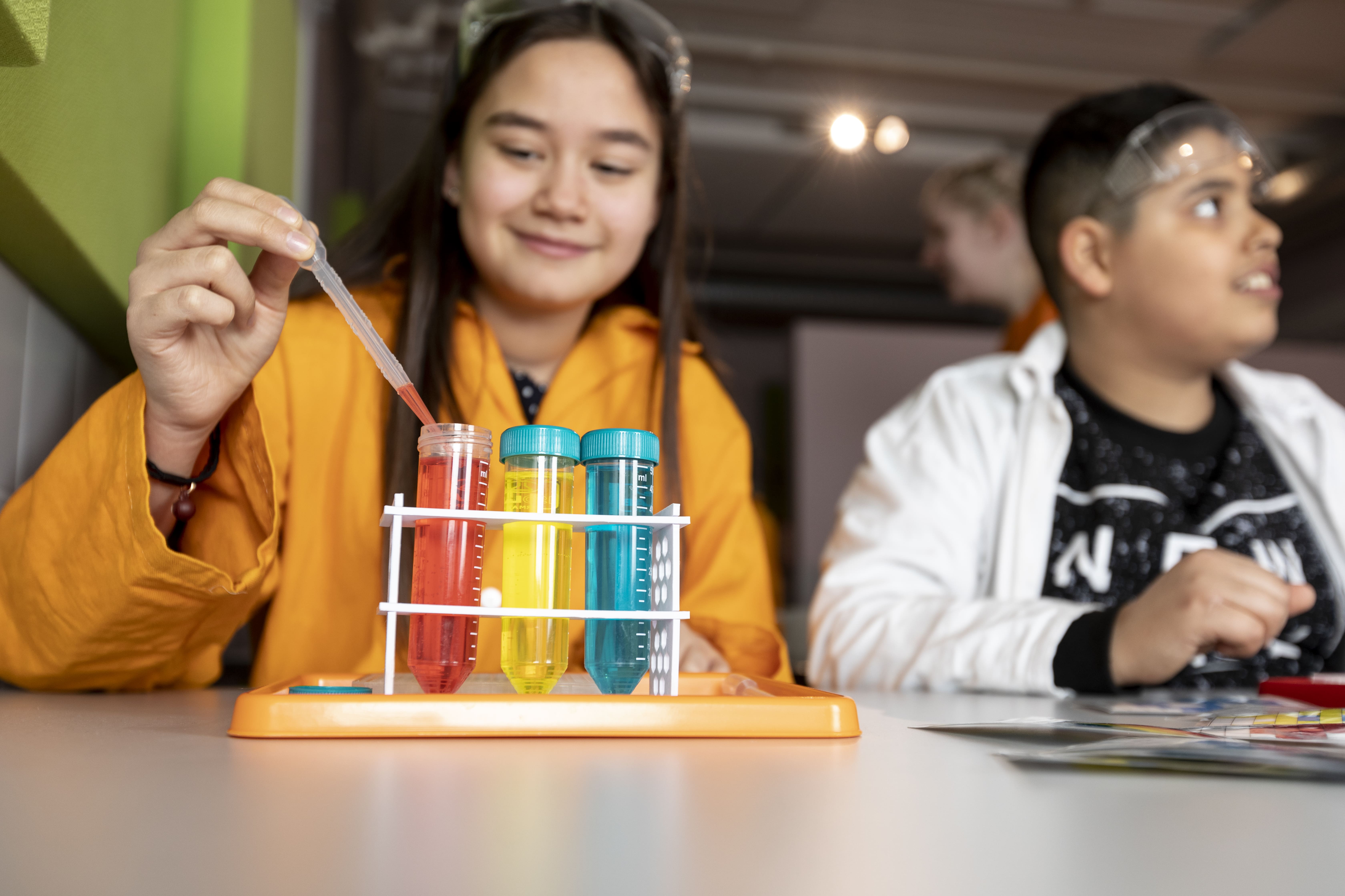 Kids doing experiments on a science center