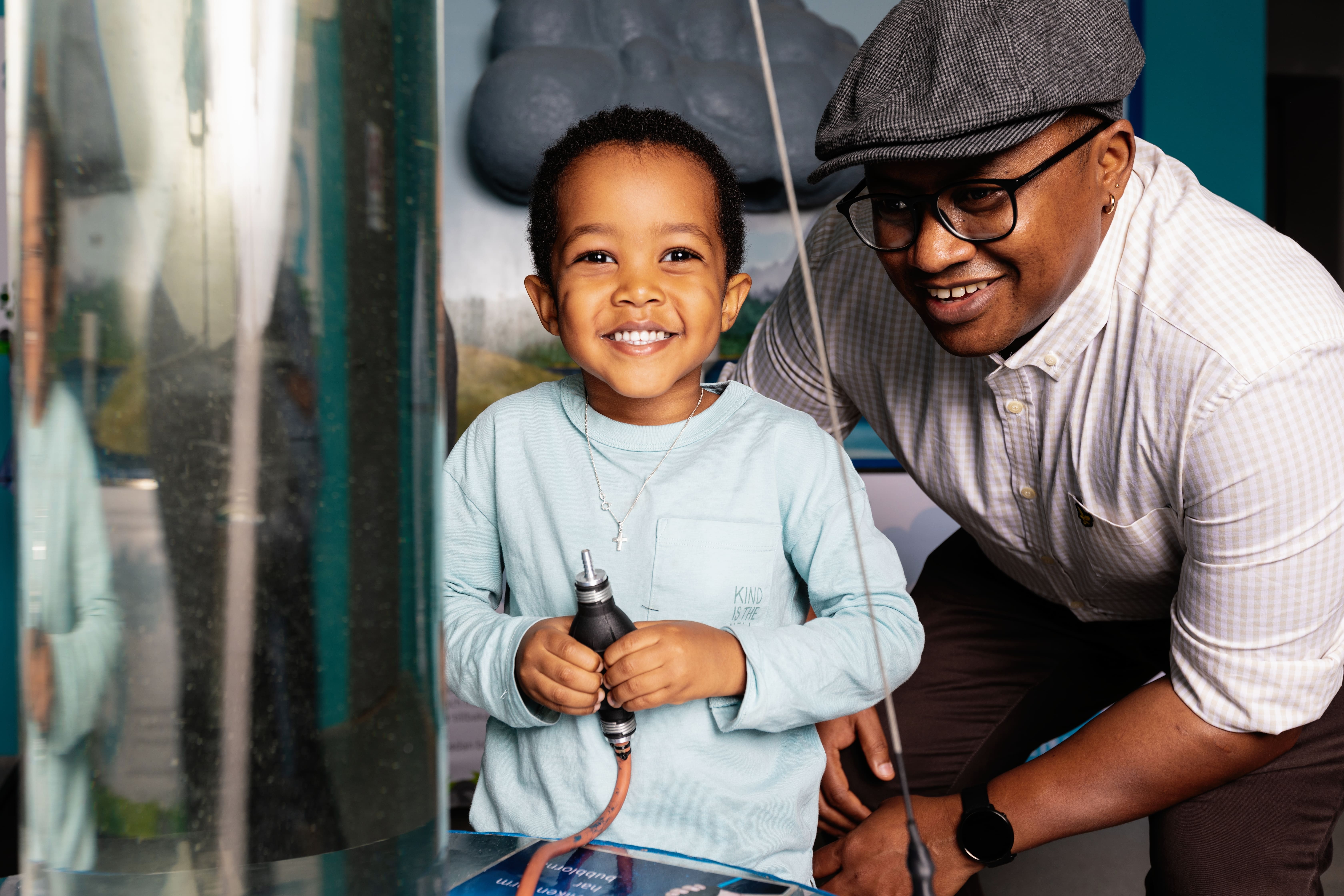 Family doing experiments on a science center