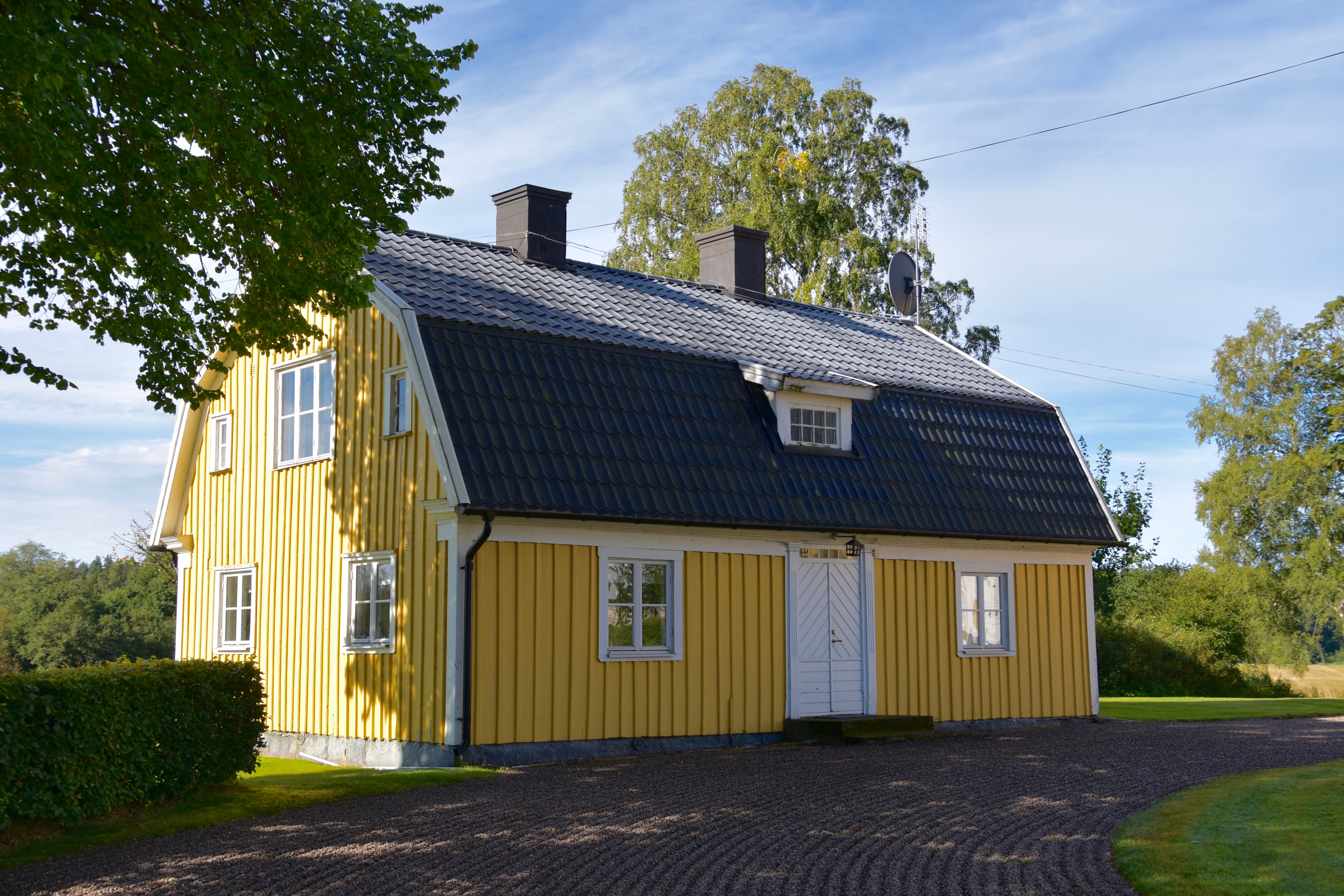 Yellow wooden house in the country.
