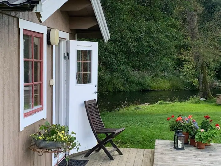 Exterior on the gable of a summer residence in summer greenery.
