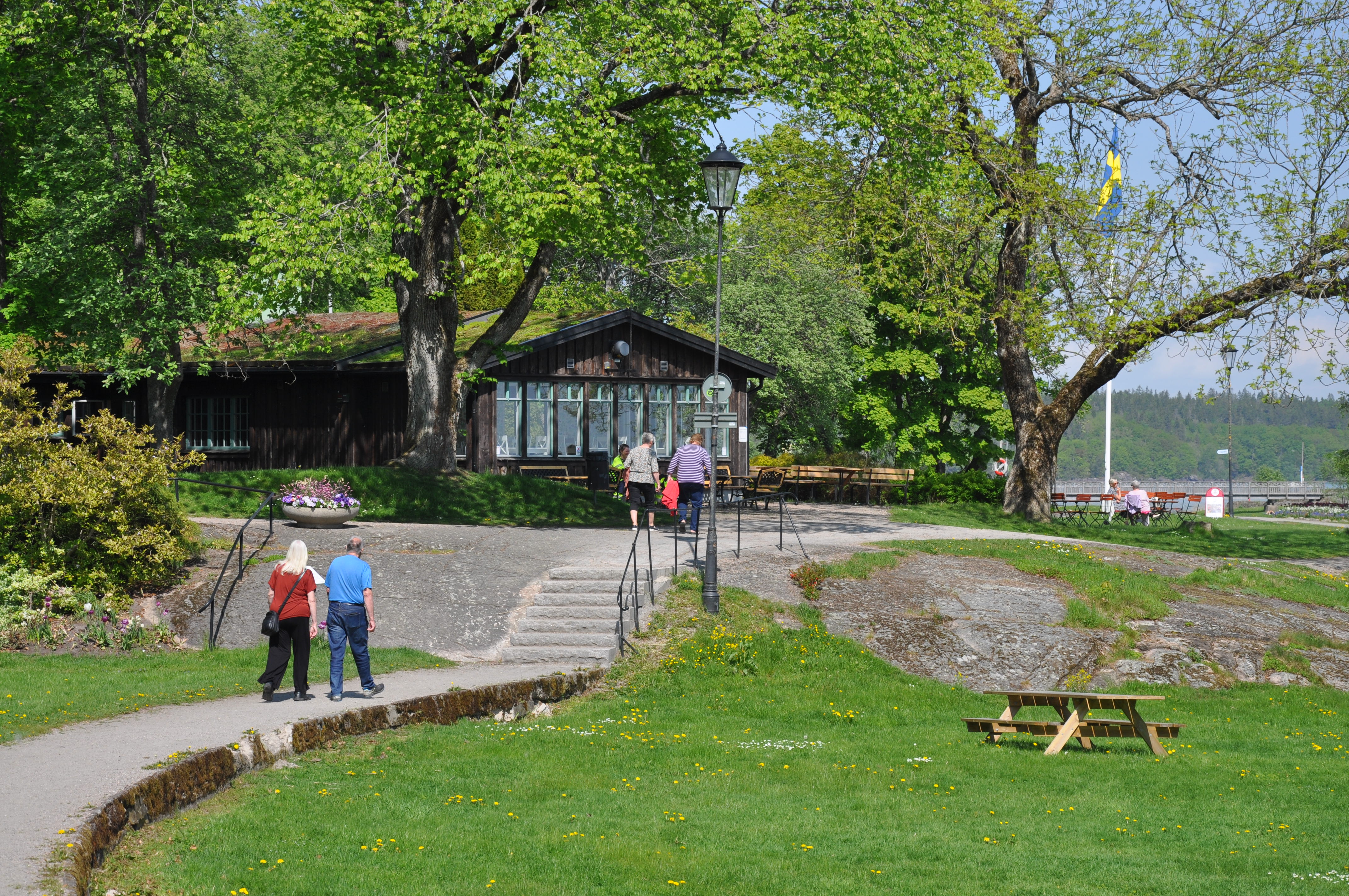 brown cottage at lake in park