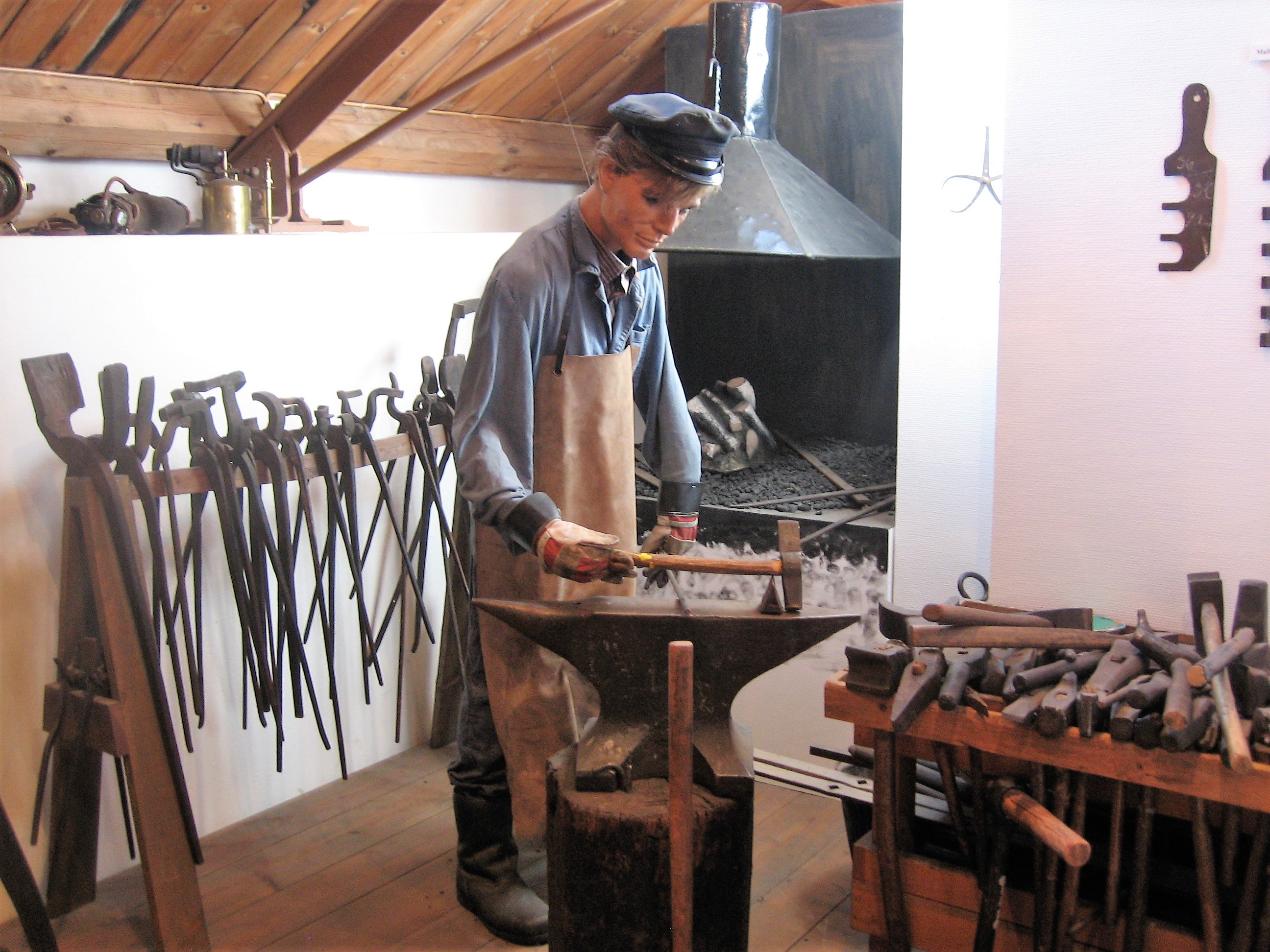 Doll in human size, making tools