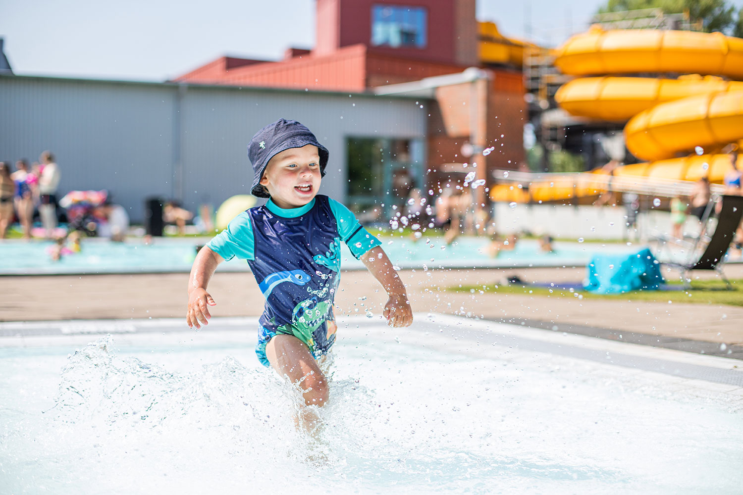 Kid playing in the pool